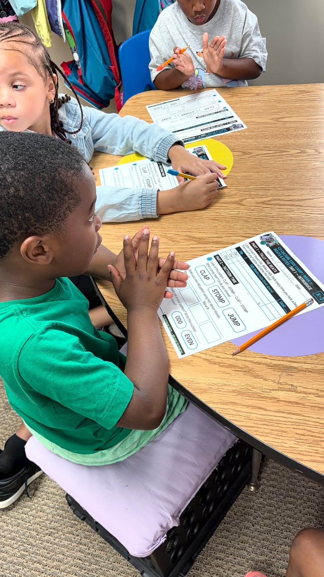 C3 scholars working on camp activities and worksheets